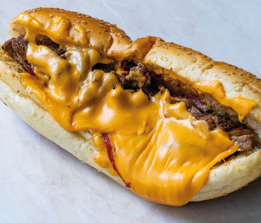 Close up of philly cheese steak with melting cheese